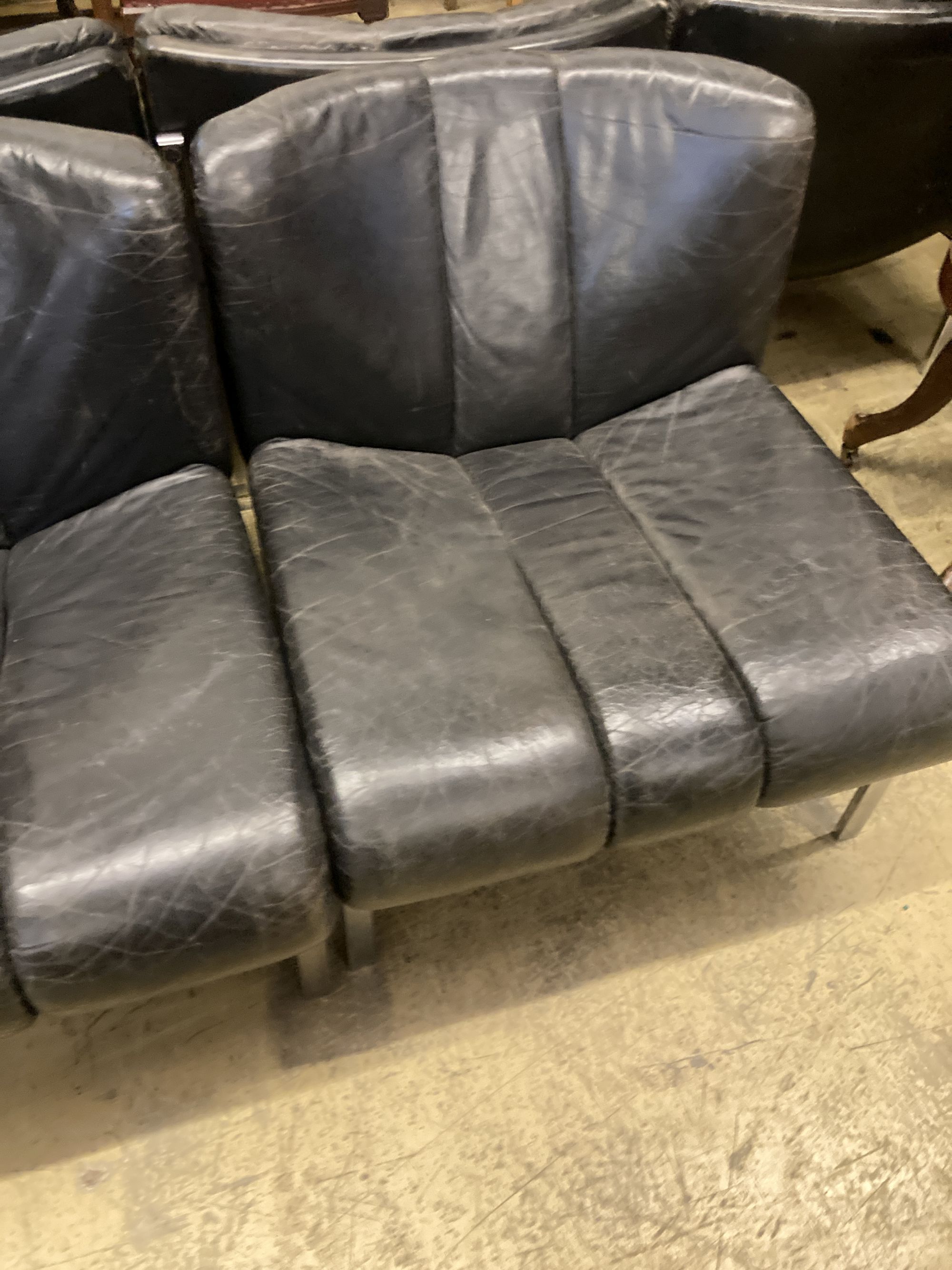 A set of five mid century black leather and chrome banquette chairs, width 65cm, depth 70cm, height 68cm